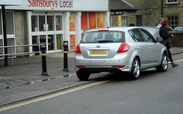 Sainsburys before Bollards - car parked across tactile pavement Sainsburys before Bollards - car parked across tactile pavement